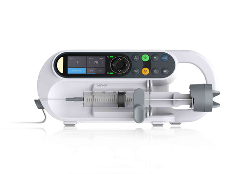 A medical syringe pump delivering precise medication doses to a patient.